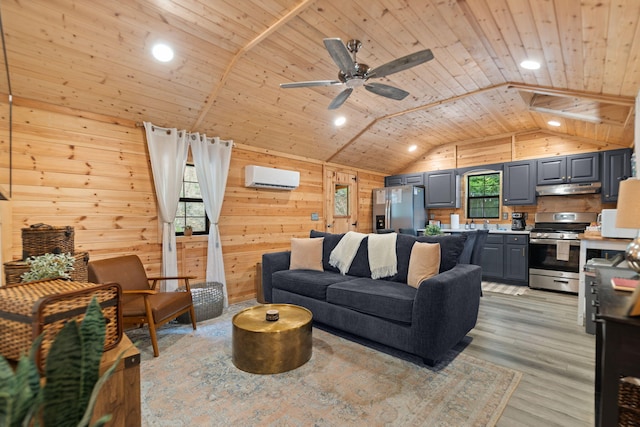 living room featuring vaulted ceiling, wood ceiling, a wall mounted AC, light wood-type flooring, and ceiling fan