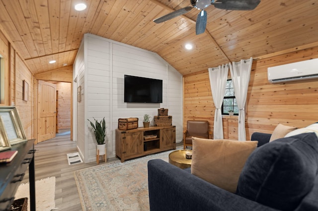 living room featuring ceiling fan, wooden ceiling, wooden walls, and light hardwood / wood-style floors