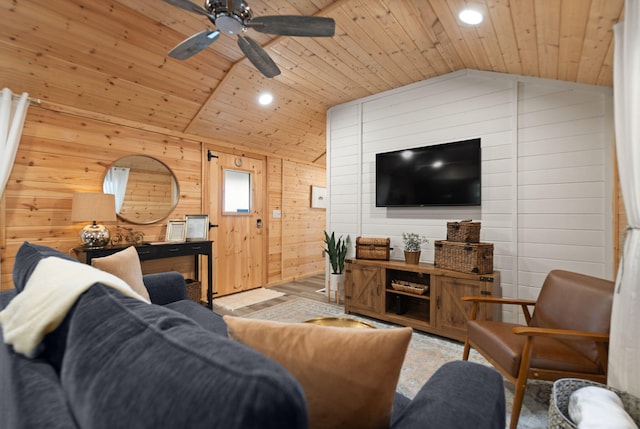 living room featuring wood walls, wooden ceiling, ceiling fan, and lofted ceiling