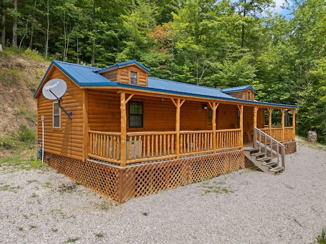 log cabin with a porch