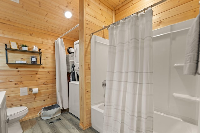 bathroom with shower / tub combo, wood-type flooring, wooden walls, and wooden ceiling