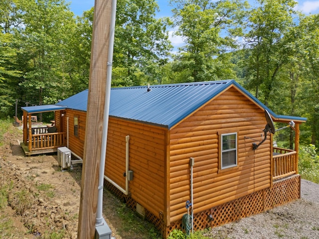 view of property exterior featuring a wooden deck