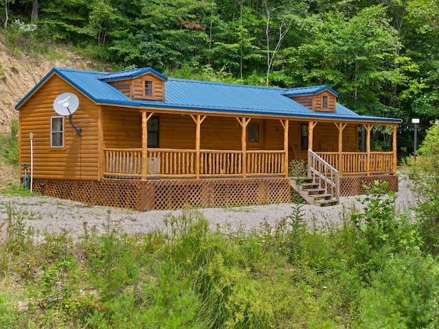 cabin featuring covered porch