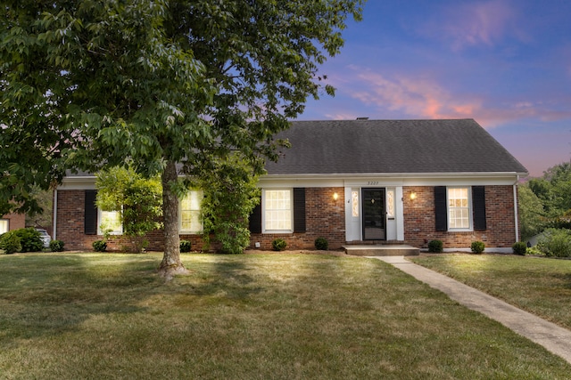 view of front of house with a lawn