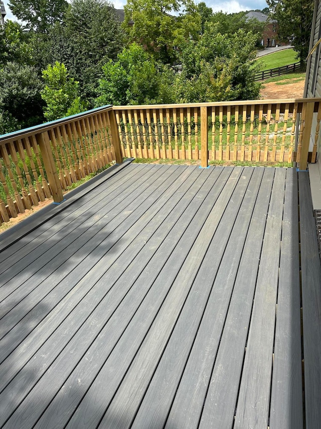 wooden deck featuring fence