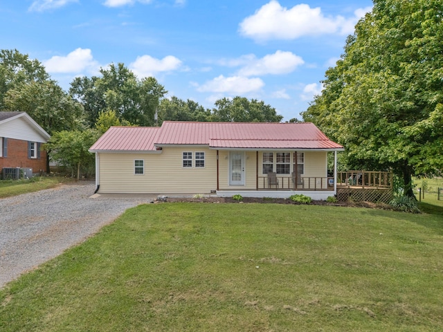 ranch-style house featuring central AC, a front yard, and a porch