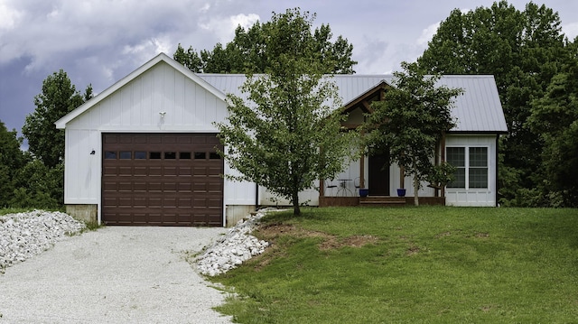 modern inspired farmhouse with a garage and a front lawn