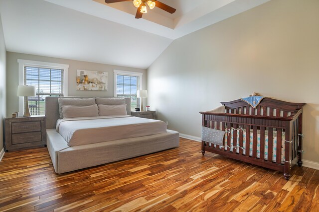 bedroom featuring wood-type flooring, ceiling fan, and lofted ceiling