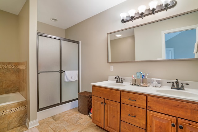 bathroom featuring tile patterned flooring, walk in shower, and dual bowl vanity