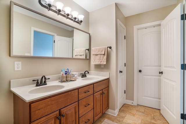 bathroom featuring tile patterned flooring and dual vanity