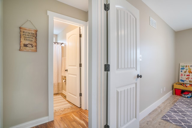 corridor featuring light hardwood / wood-style flooring