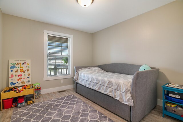 bedroom featuring wood-type flooring