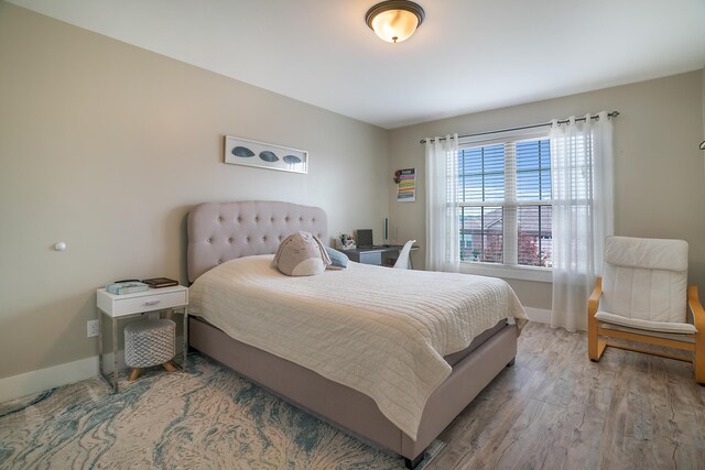 bedroom with light hardwood / wood-style floors