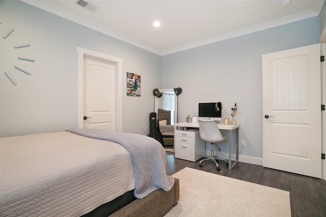 bedroom with crown molding and dark hardwood / wood-style floors