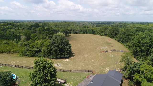 birds eye view of property with a rural view