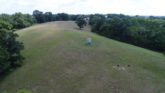 birds eye view of property with a rural view