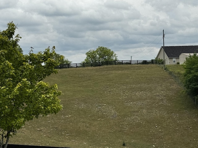 view of yard with a rural view