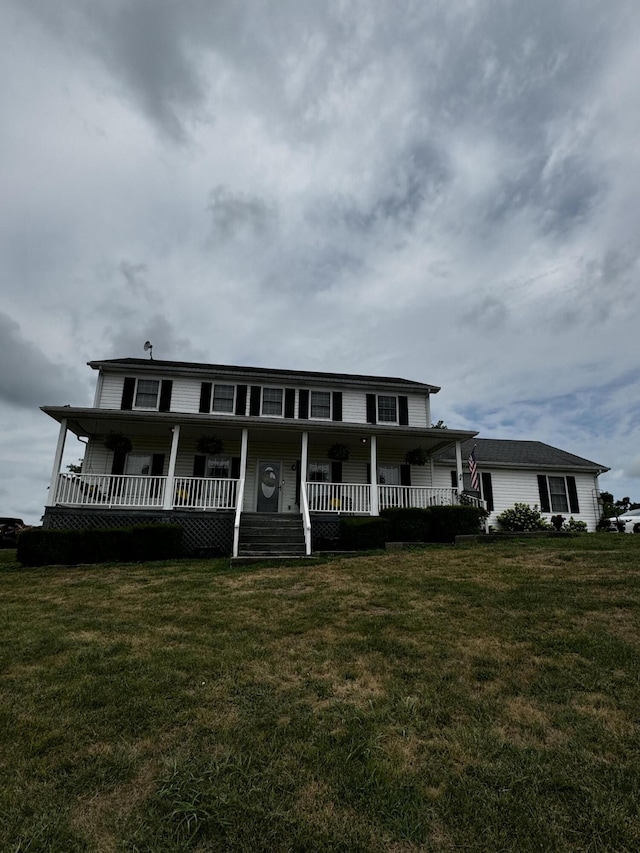 country-style home with a front lawn