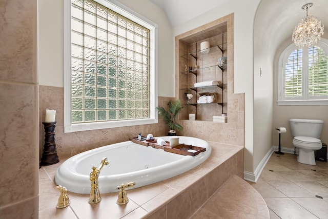 bathroom featuring tile patterned floors, lofted ceiling, toilet, independent shower and bath, and an inviting chandelier