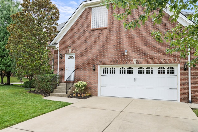 view of front of house featuring a front lawn and a garage