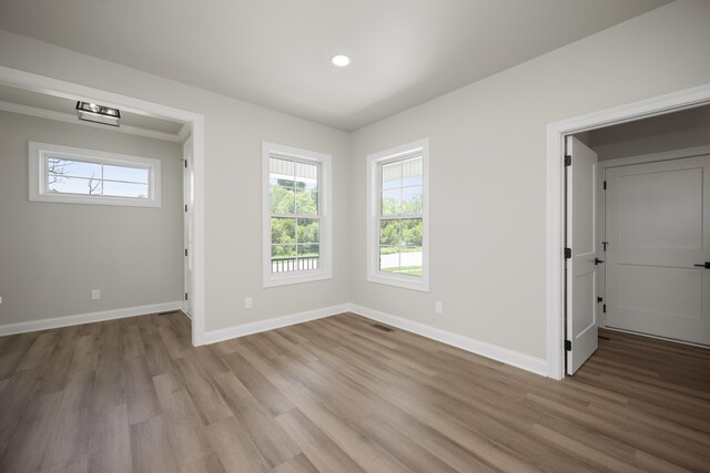 empty room with light wood-type flooring