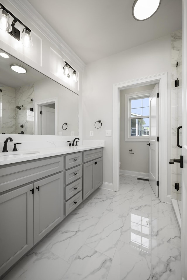 bathroom featuring an enclosed shower and vanity