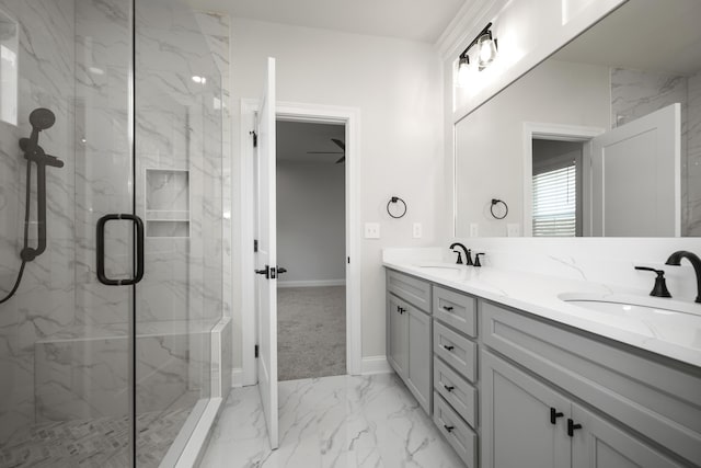 bathroom with vanity and a shower with door