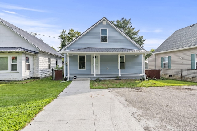 bungalow-style home with a porch and a front yard