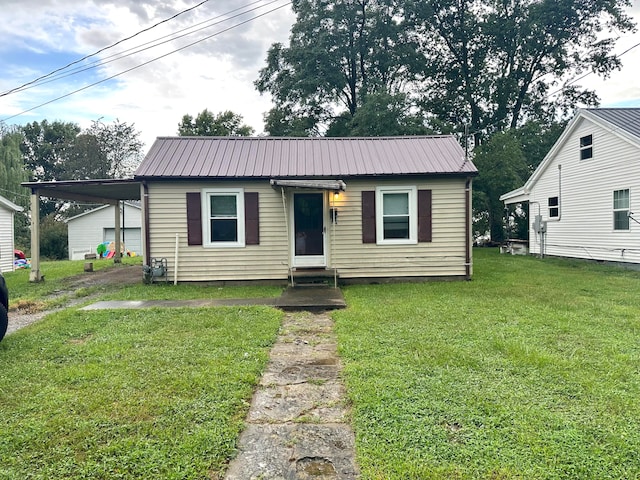 bungalow with a carport and a front yard