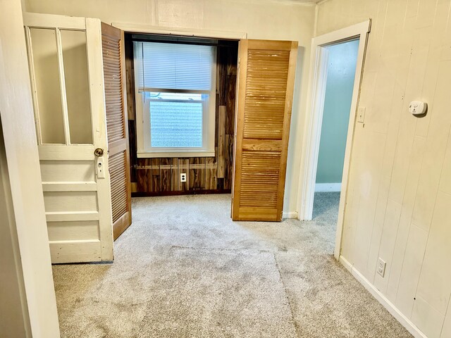 unfurnished bedroom with light carpet