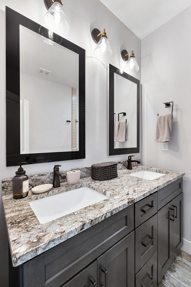 bathroom with dual vanity