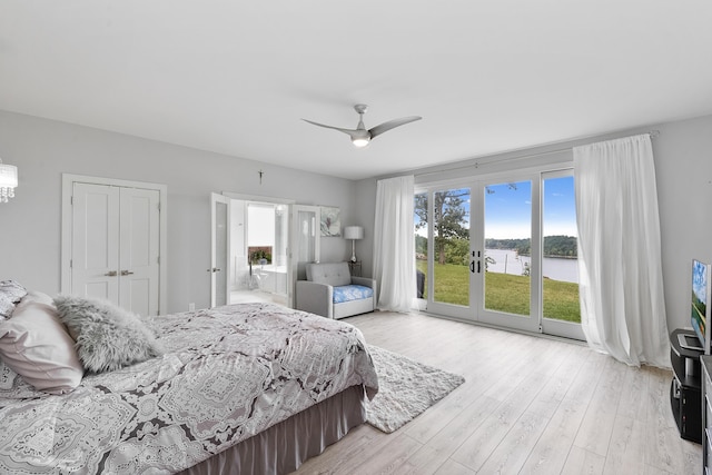 bedroom featuring french doors, access to outside, a closet, ceiling fan, and light hardwood / wood-style floors