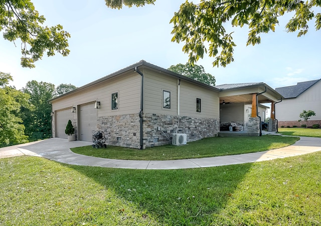 view of home's exterior with a garage, a lawn, and ac unit