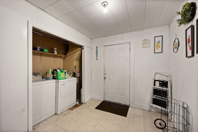 106 18th St, Corbin, KY 40701 - clothes washing area with washing machine and clothes dryer and light tile patterned flooring