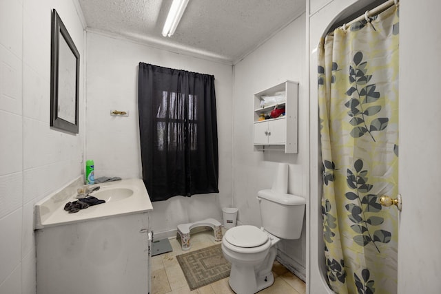 106 18th St, Corbin, KY 40701 - bathroom featuring tile patterned flooring, toilet, vanity, and a textured ceiling