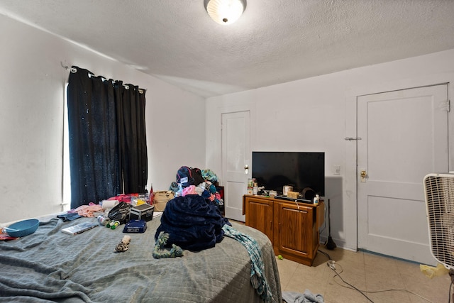 106 18th St, Corbin, KY 40701 - tiled bedroom with a textured ceiling