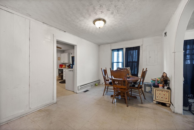 106 18th St, Corbin, KY 40701 - dining area with light tile patterned flooring and a textured ceiling