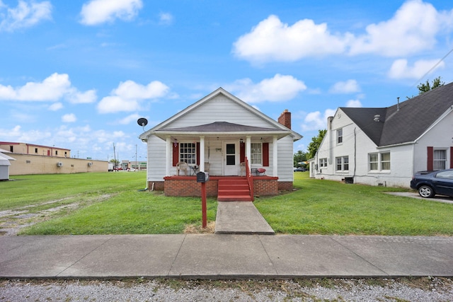 106 18th St, Corbin, KY 40701 - view of front facade featuring a porch and a front yard
