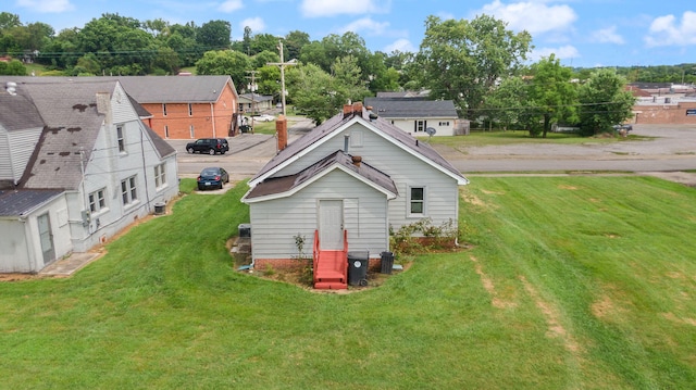 106 18th St, Corbin, KY 40701 - rear view of property featuring a yard