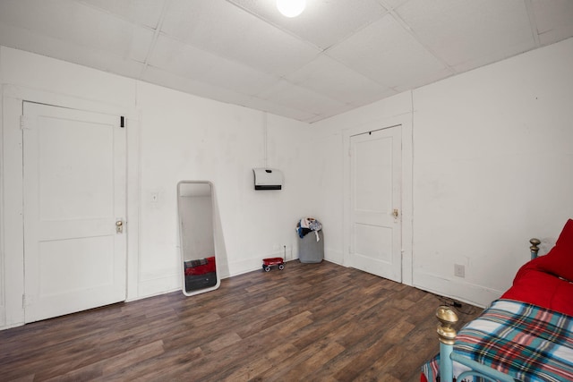 106 18th St, Corbin, KY 40701 - unfurnished bedroom with wood-type flooring and a paneled ceiling
