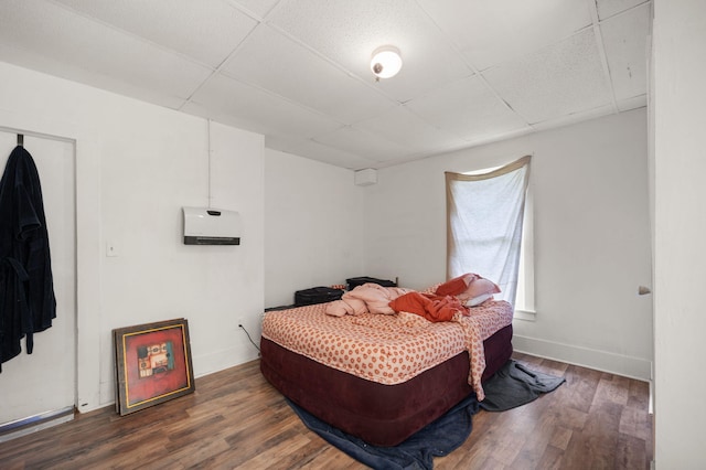 106 18th St, Corbin, KY 40701 - bedroom with a paneled ceiling and hardwood / wood-style flooring