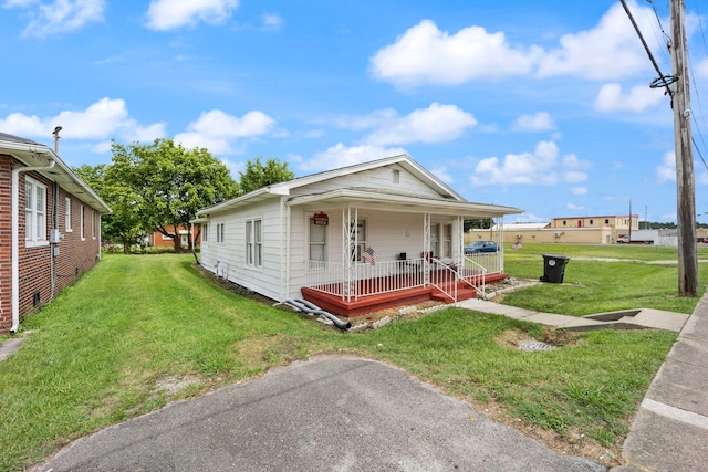 106 18th St, Corbin, KY 40701 - view of front facade featuring a porch and a front lawn