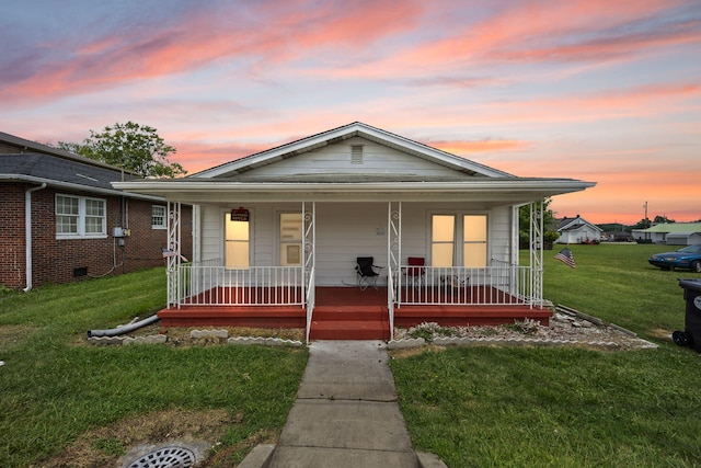 106 18th St, Corbin, KY 40701 - bungalow-style home with a porch and a yard