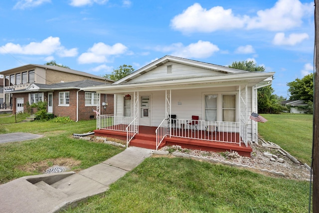 106 18th St, Corbin, KY 40701 - view of front facade featuring a front lawn and covered porch