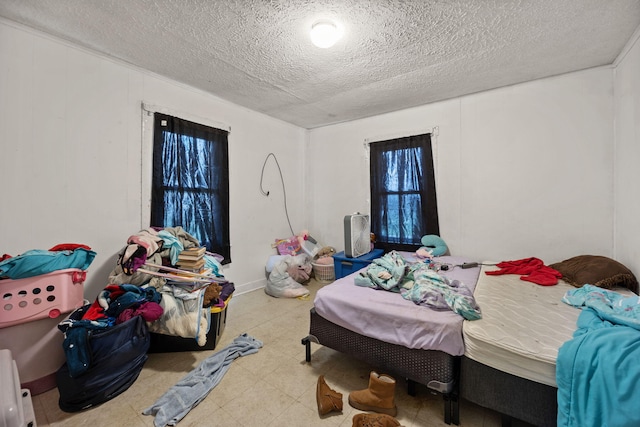 106 18th St, Corbin, KY 40701 - bedroom with light tile patterned flooring and a textured ceiling