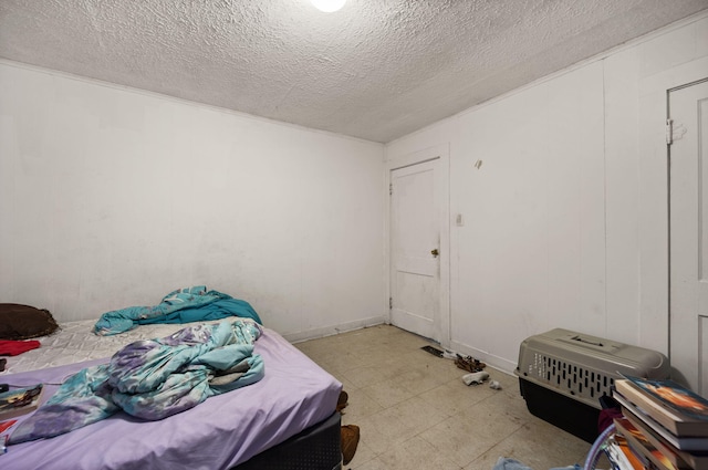 106 18th St, Corbin, KY 40701 - bedroom with light tile patterned flooring and a textured ceiling