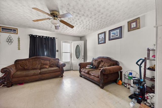 106 18th St, Corbin, KY 40701 - tiled living room with a textured ceiling and ceiling fan