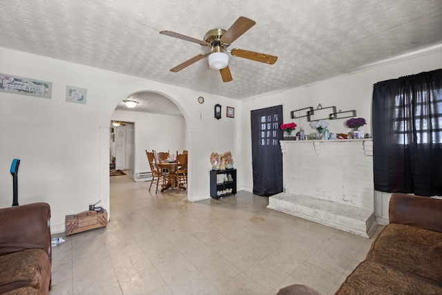 106 18th St, Corbin, KY 40701 - living room with a textured ceiling, light tile patterned floors, and ceiling fan