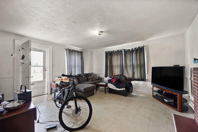 106 18th St, Corbin, KY 40701 - tiled living room featuring a textured ceiling