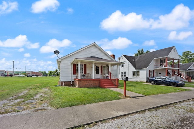 106 18th St, Corbin, KY 40701 - bungalow featuring covered porch and a front yard